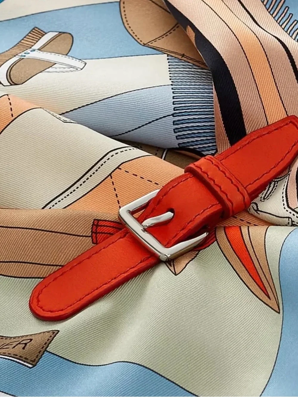 Hermes Pele Mele Silk Scarf with leather buckle.